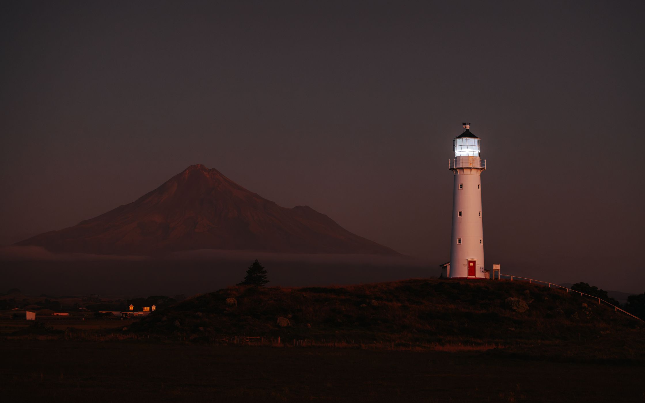 Cape Egmont Lighthouse with Mount Taranaki, Pungarehu, New Zealand