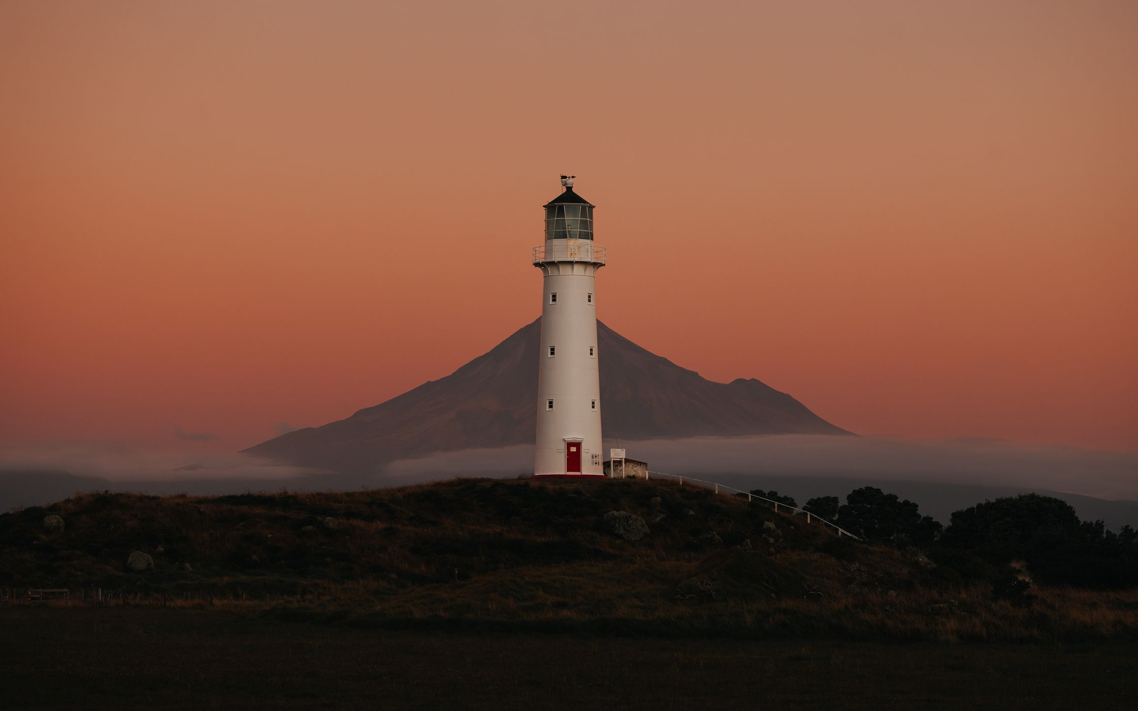Cape Egmont Lighthouse with Mount Taranaki, Pungarehu, New Zealand