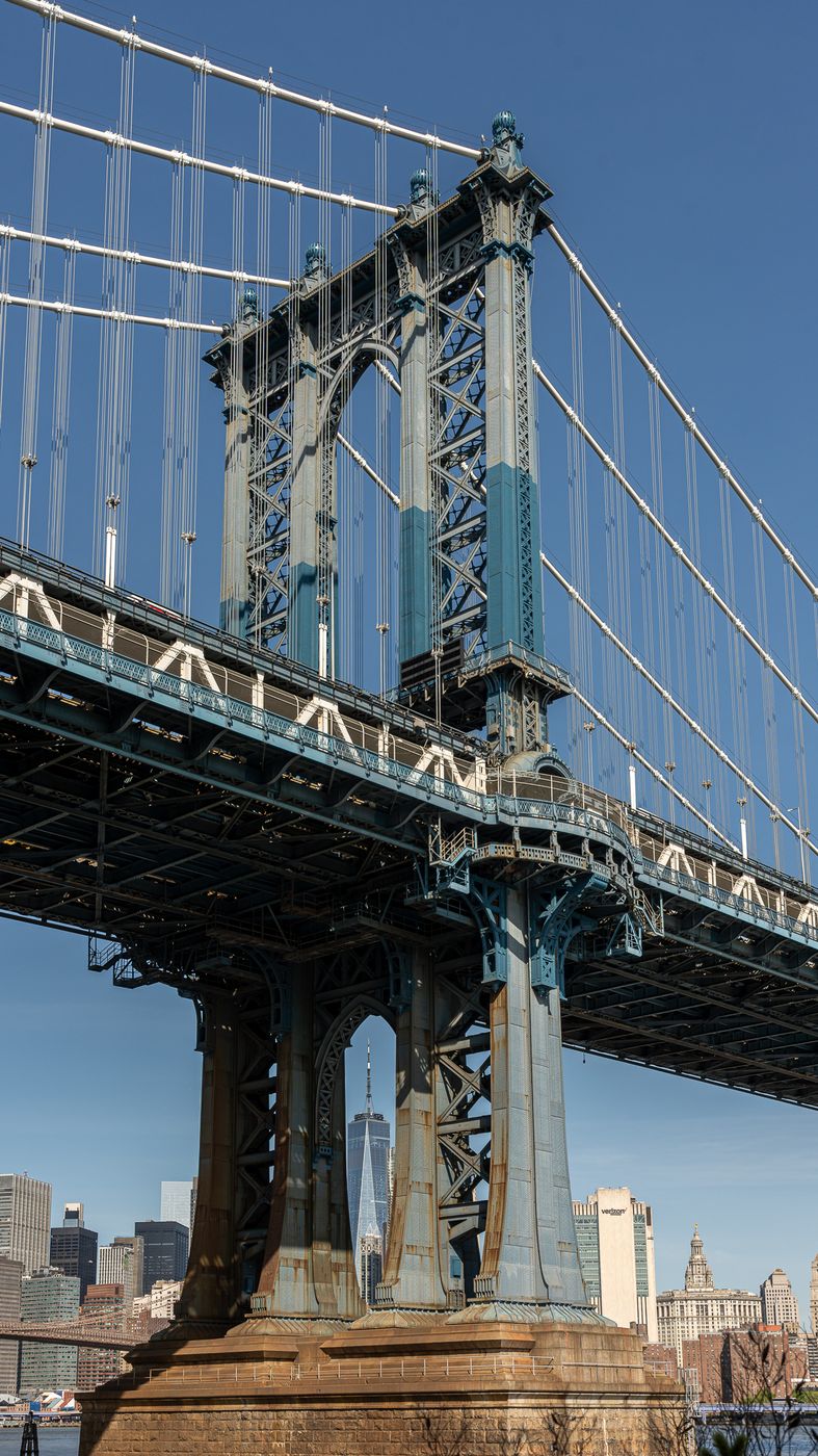 Empire State Building framed by Manhattan Bridge, New York City, USA