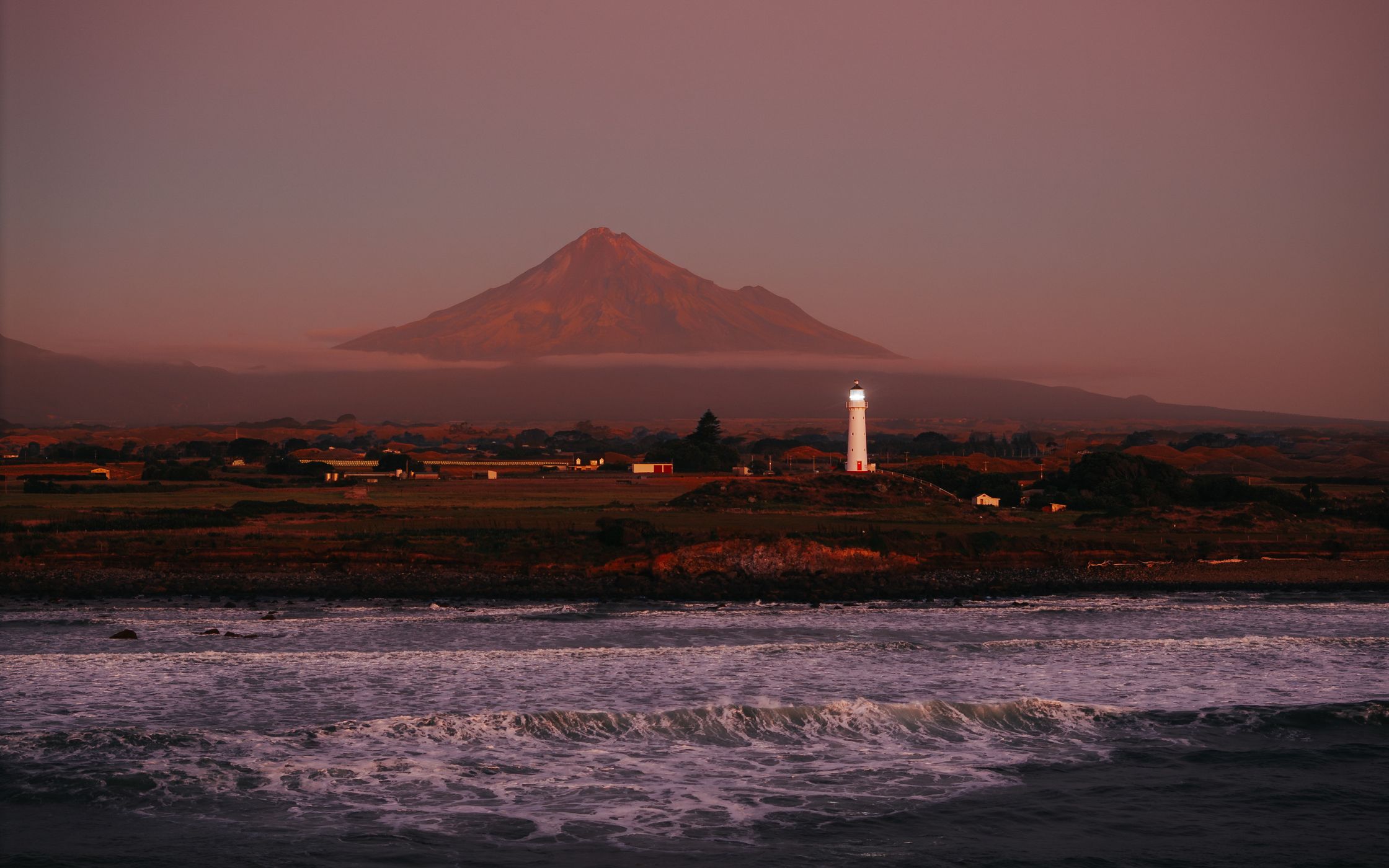 Cape Egmont Lighthouse with Mount Taranaki, Pungarehu, New Zealand