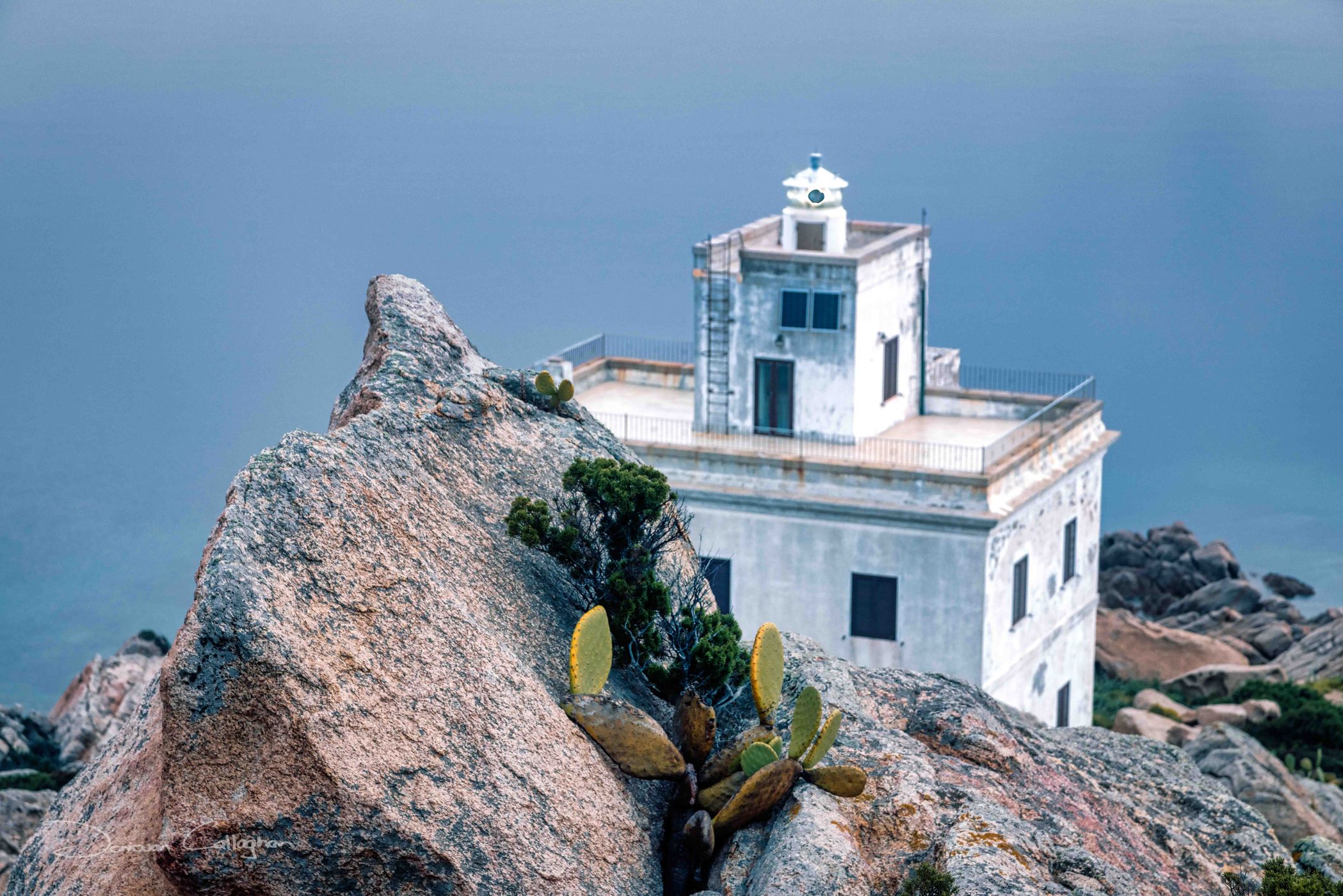Cliff face Faro di Punta Sardegna, Sardinia, Italy