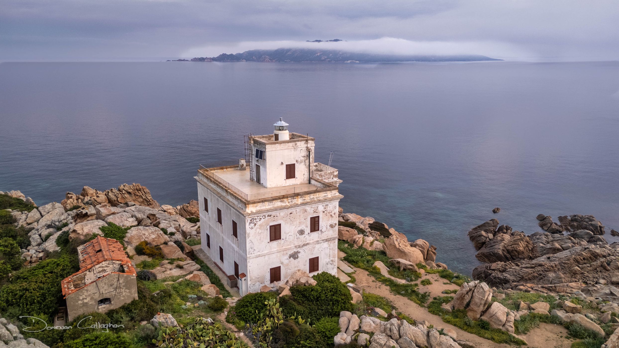 Corsica cloud cover, Faro di Punta Sardegna, Sardinia, Italy
