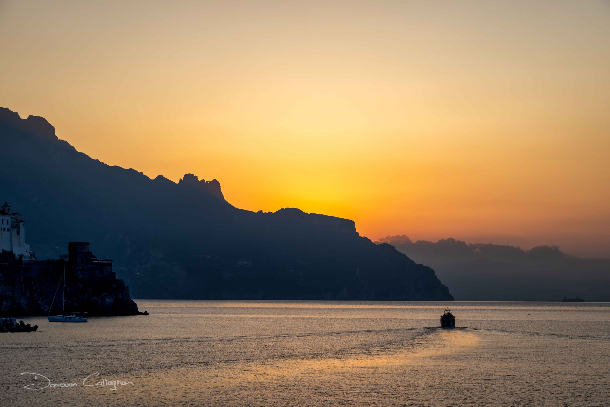 Fishing boat sunrise, Amalfi,, Italy