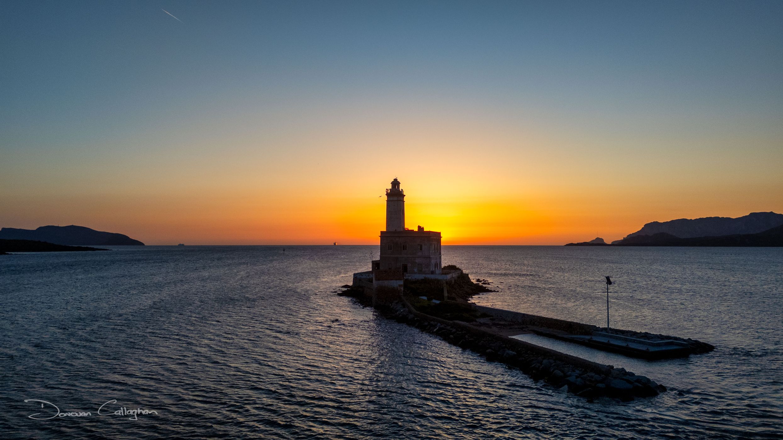 Flowers Faro di Bocca Lighthouse, Sardinia, Italy