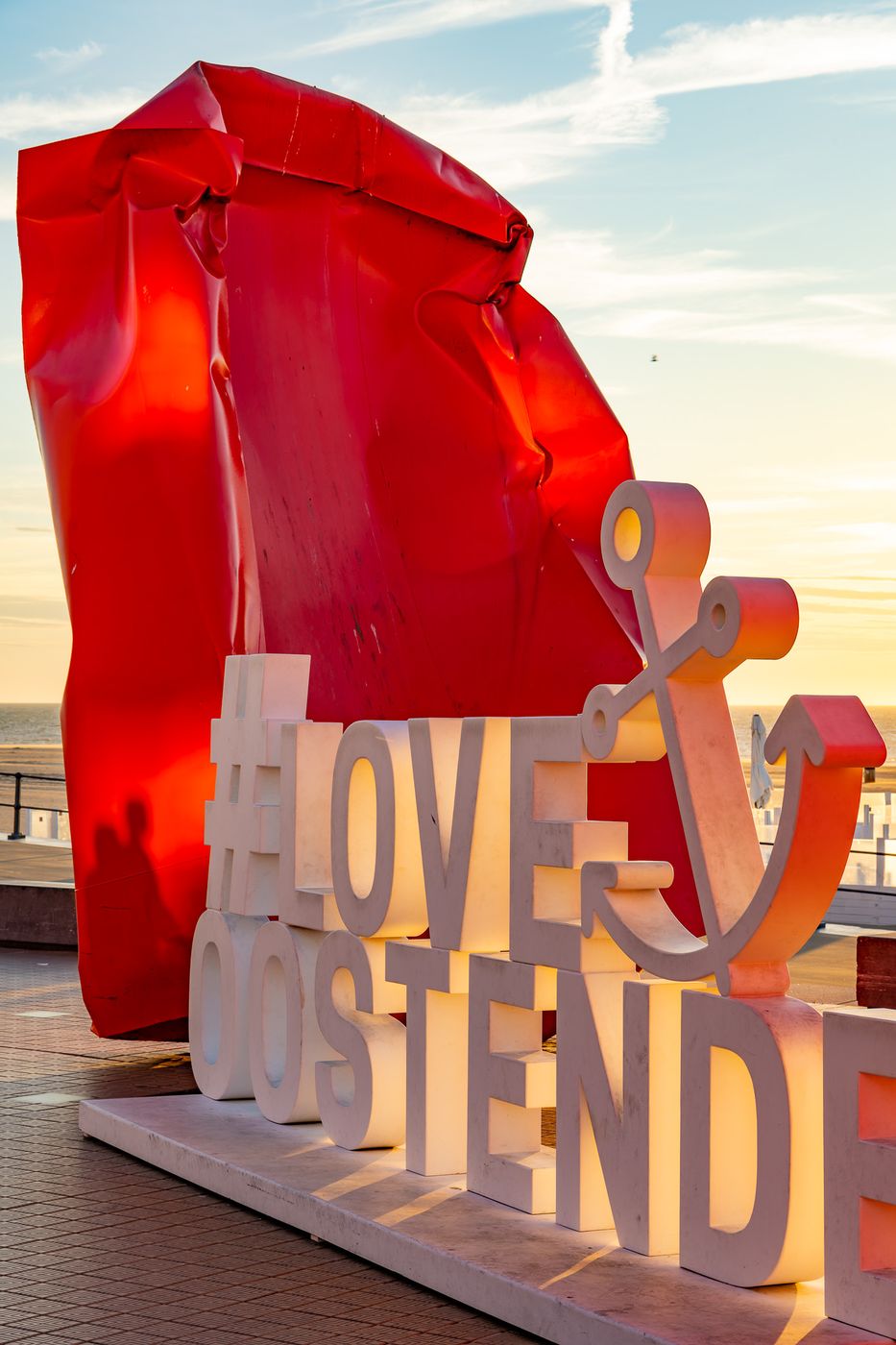 Red 'Rock Strangers' Sculpture at harbour's mouth in Ostend, Belgium