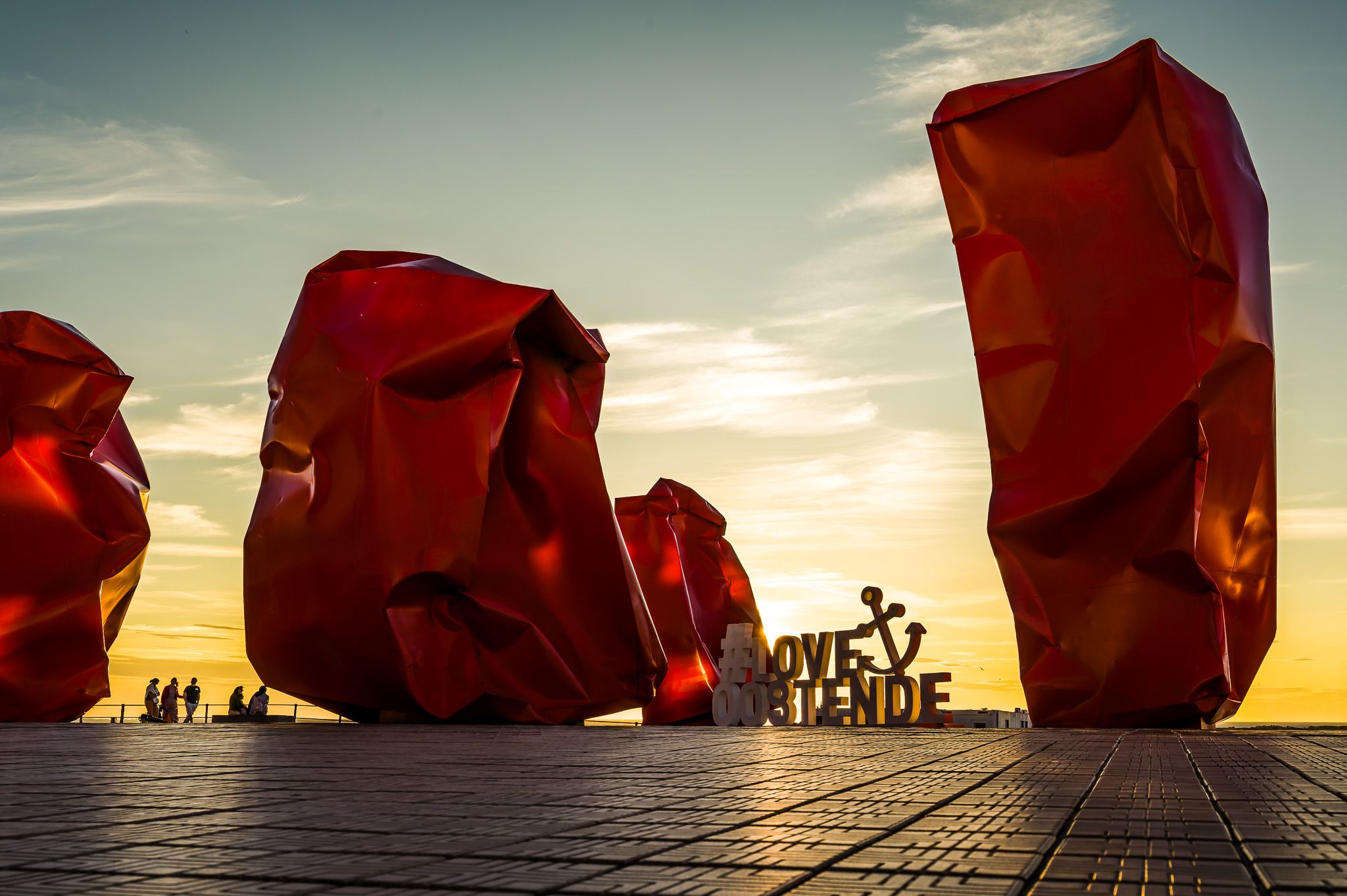 Red 'Rock Strangers' Sculpture at harbour's mouth in Ostend, Belgium