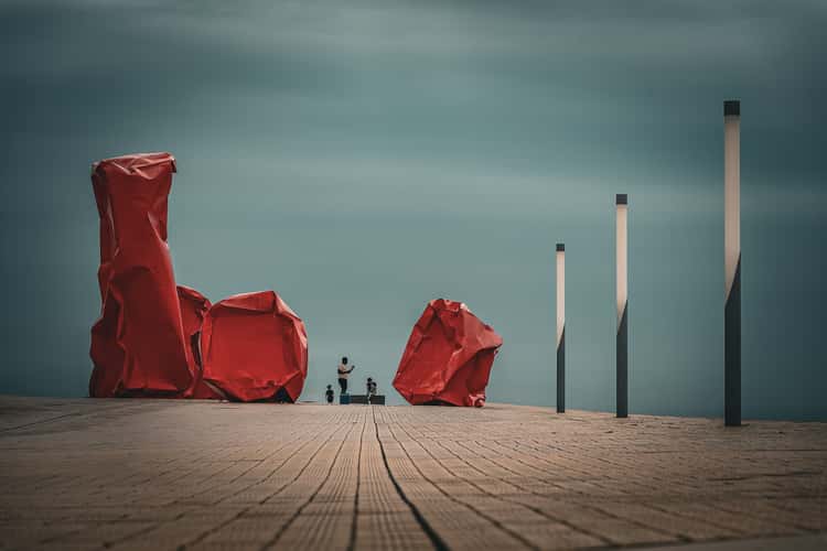 Red 'Rock Strangers' Sculpture at harbour's mouth in Ostend