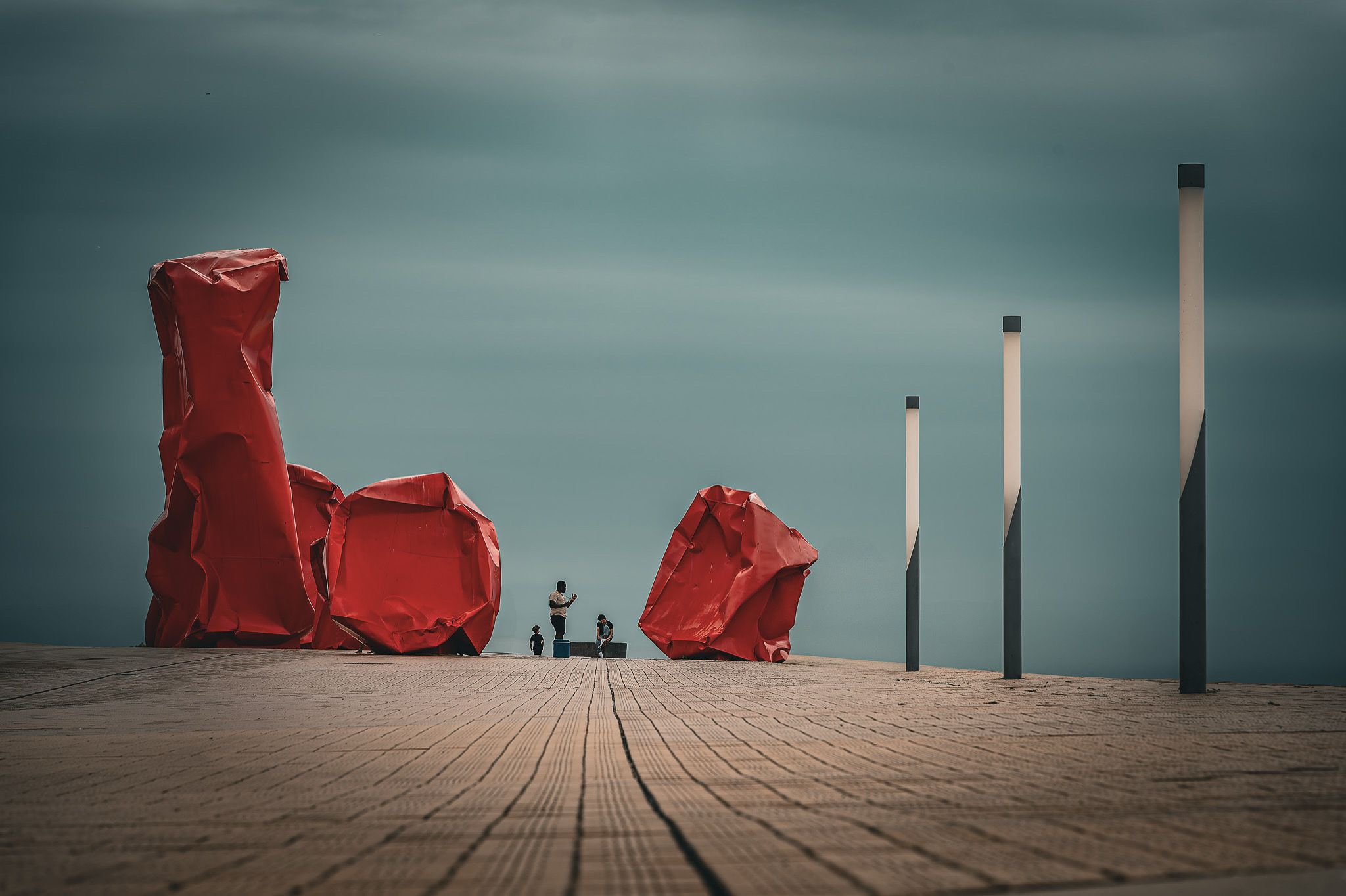 Red 'Rock Strangers' Sculpture at harbour's mouth in Ostend, Belgium