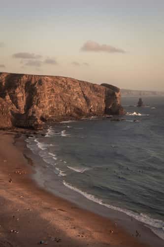 Surfer at Praia da Arrifana, Western Algarve