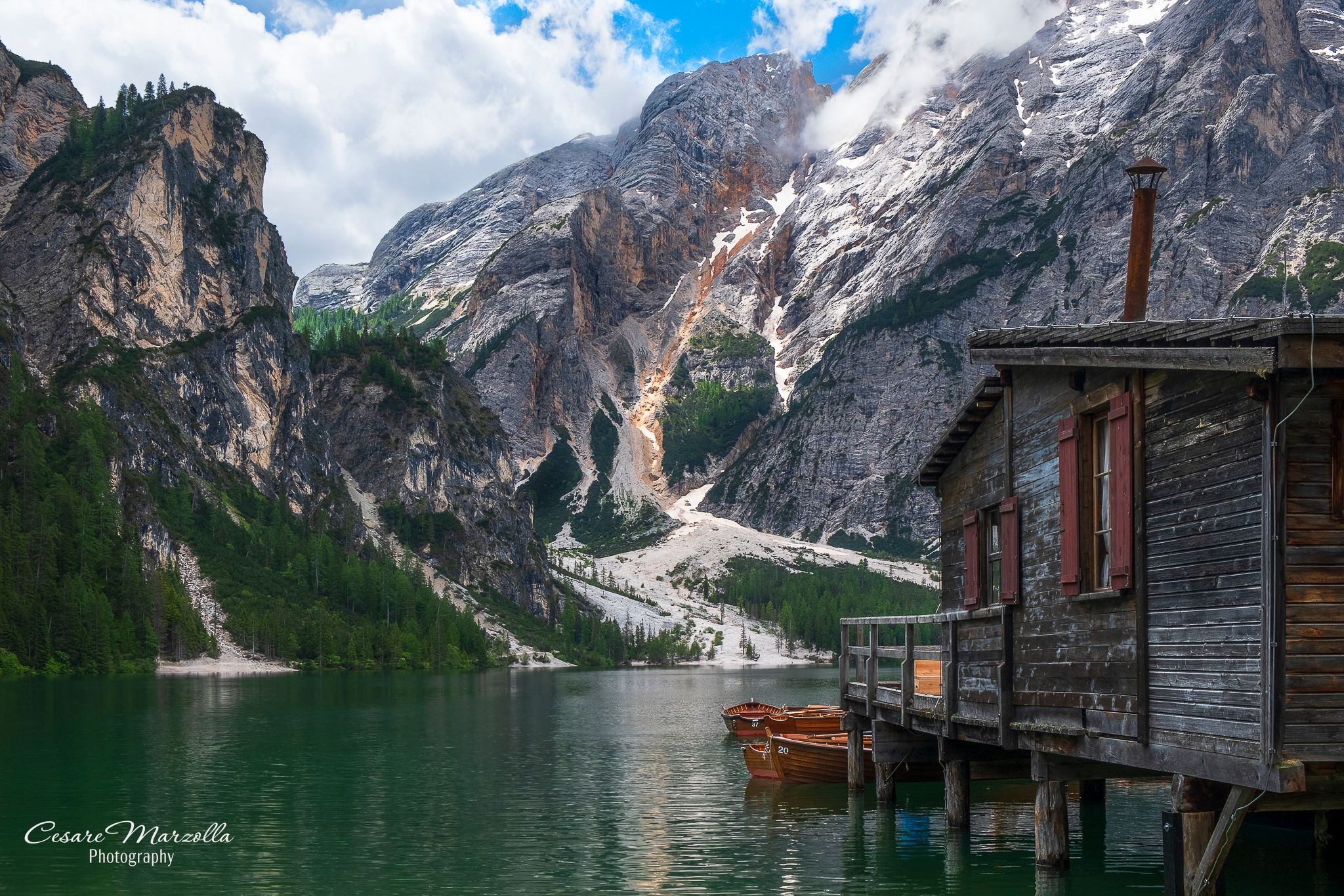 Wooden house on Lago Braies in Dolomites, Italy