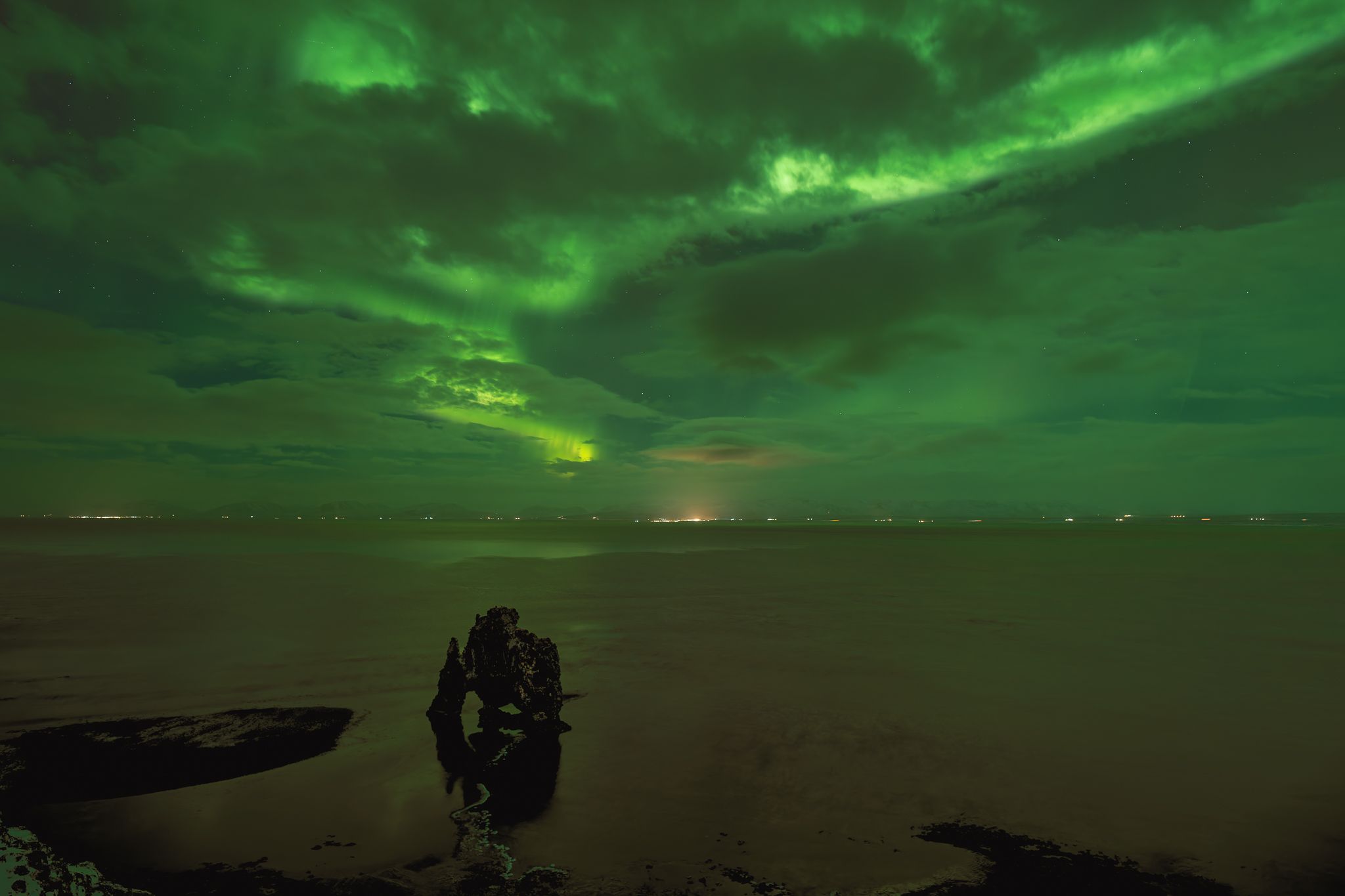 Aurora borealis above Hvitserkur, North Iceland, Iceland