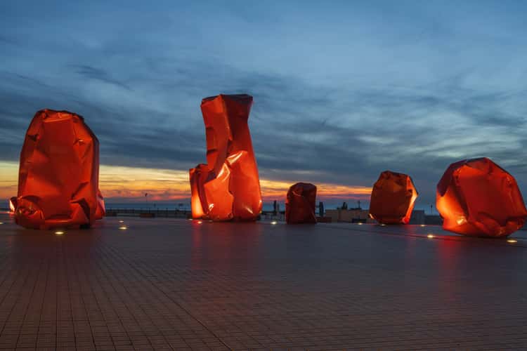 Red 'Rock Strangers' Sculpture at harbour's mouth in Ostend