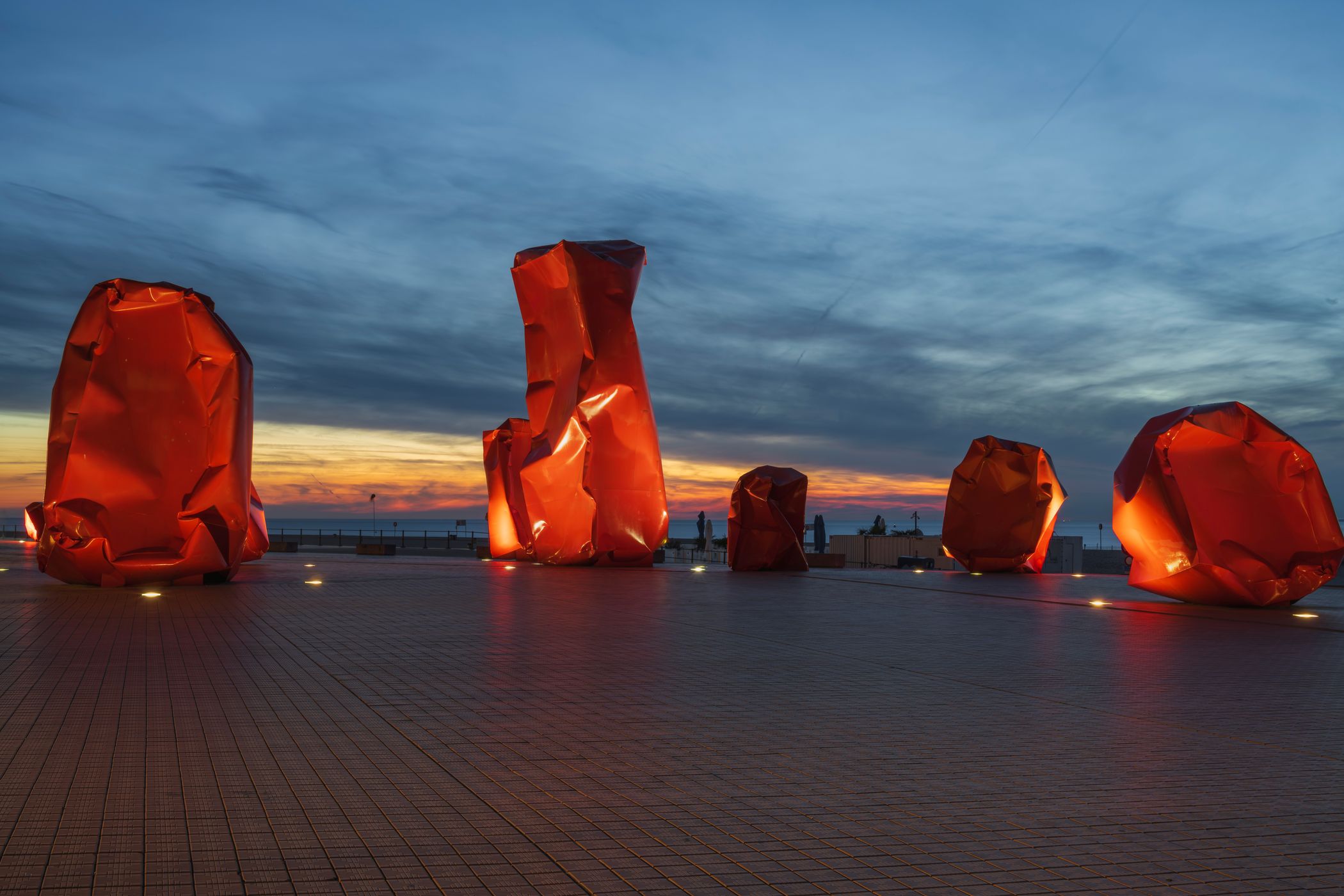 Red 'Rock Strangers' Sculpture at harbour's mouth in Ostend, Belgium