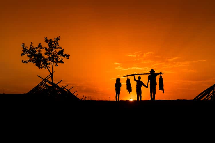 Silhouettes on the Pepper Drying Hill at Sunset