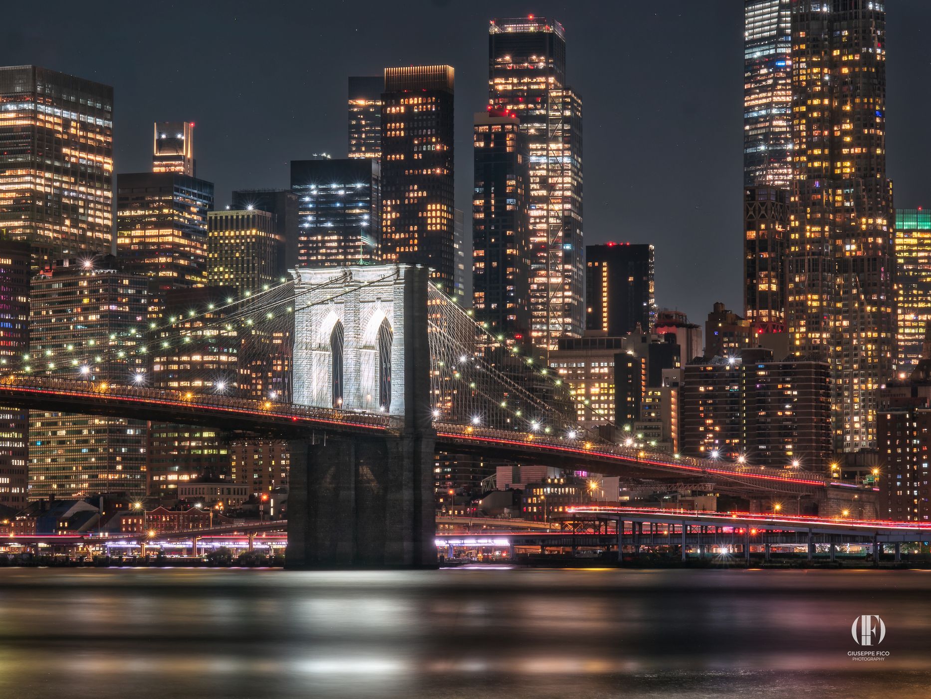Brooklyn Bridge skyline from Pebble Beach, New York City, USA