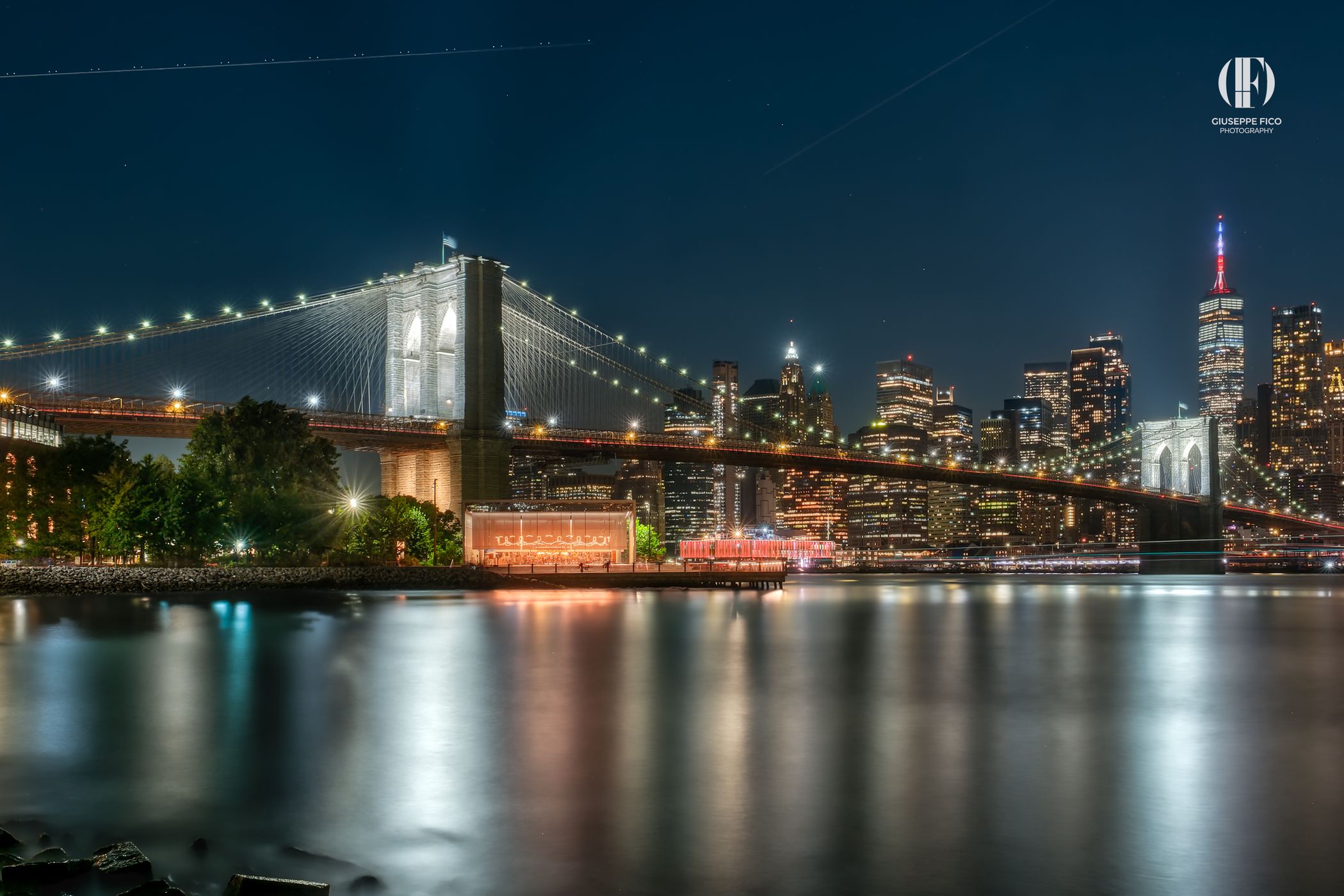 Brooklyn Bridge skyline from Pebble Beach, New York City, USA