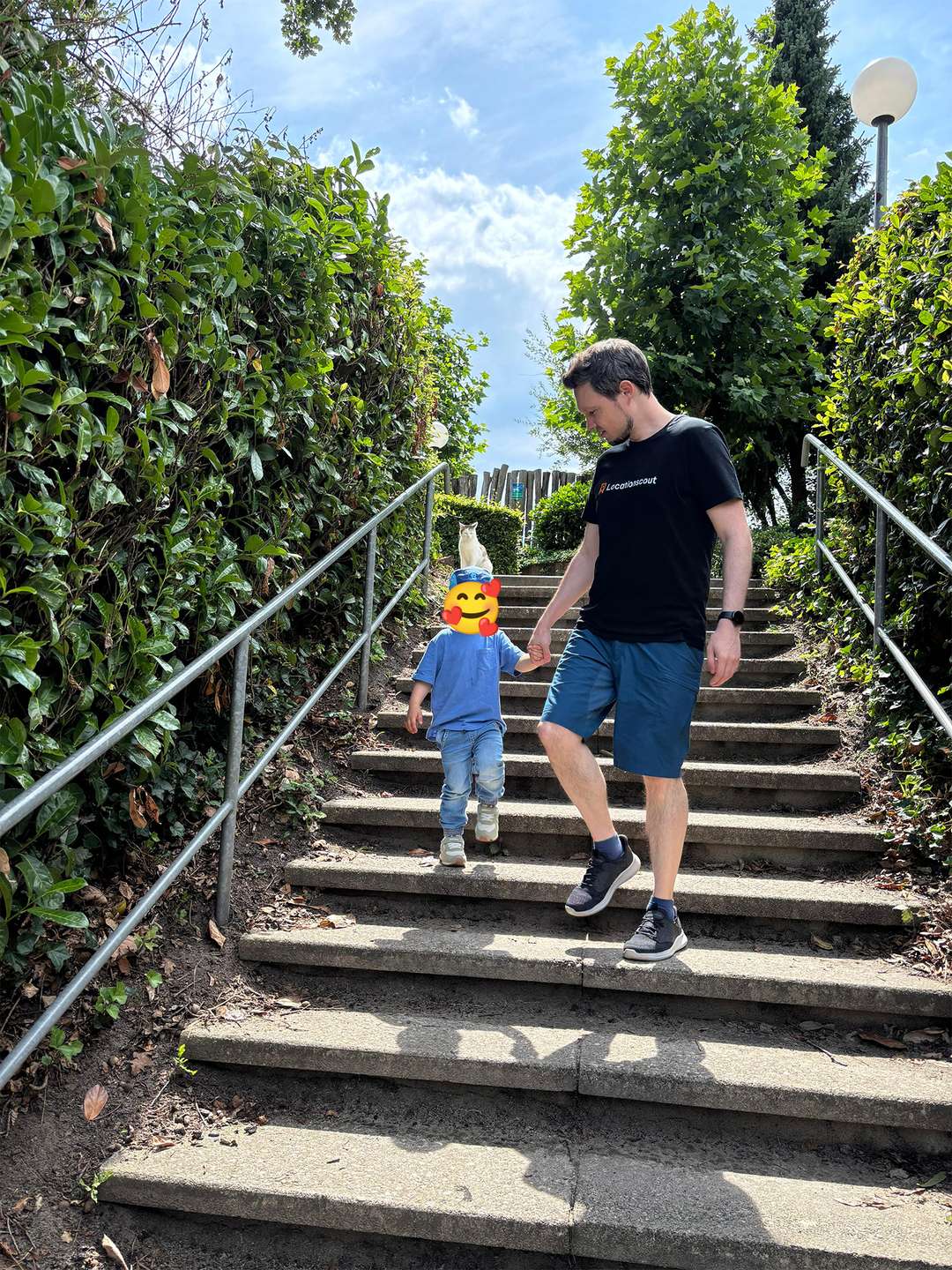 Me with my younger son - looks like the cat is sitting on his head... :-D