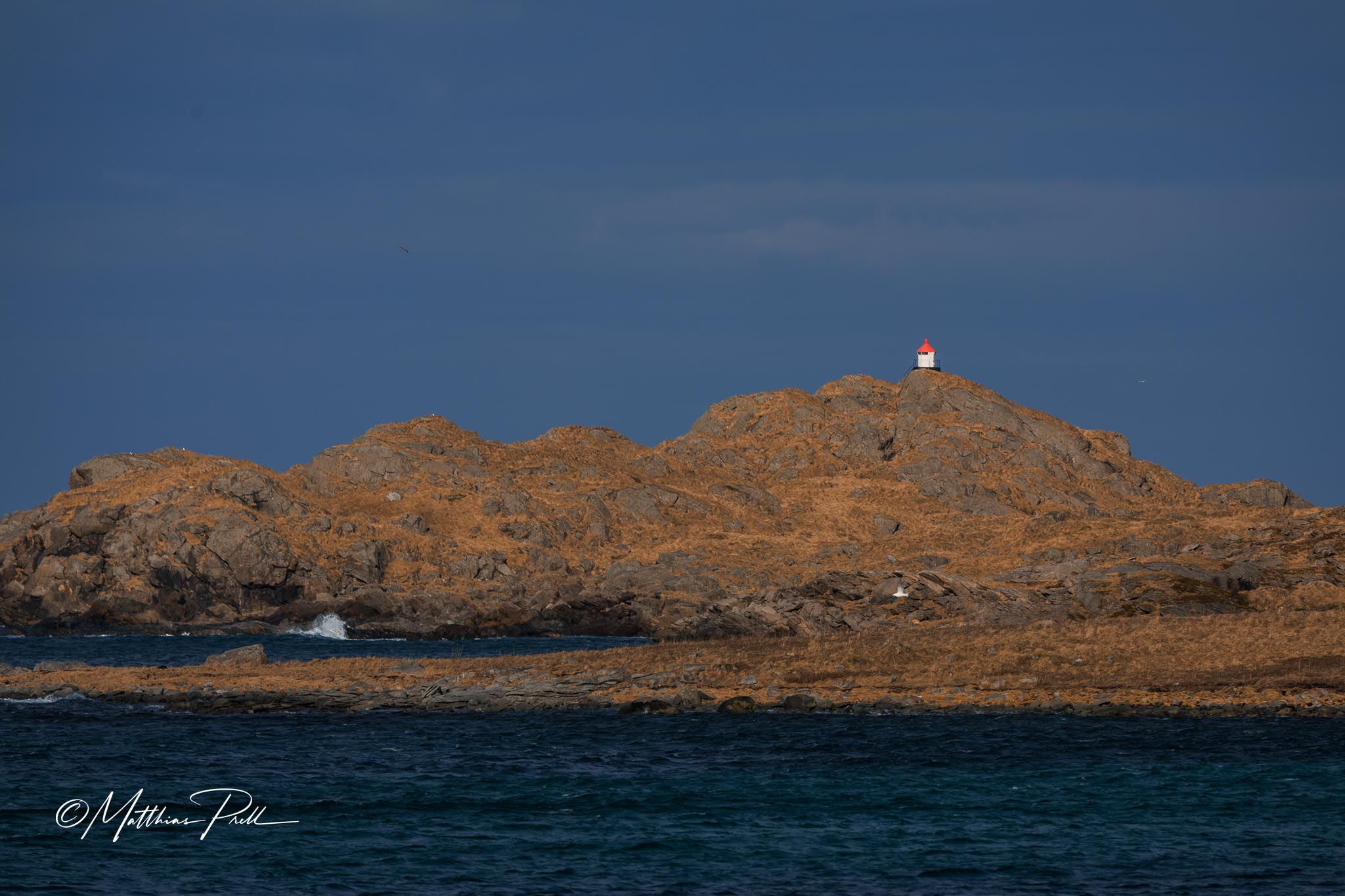 Red hut at Ramberg beach, Lofoten, Norway