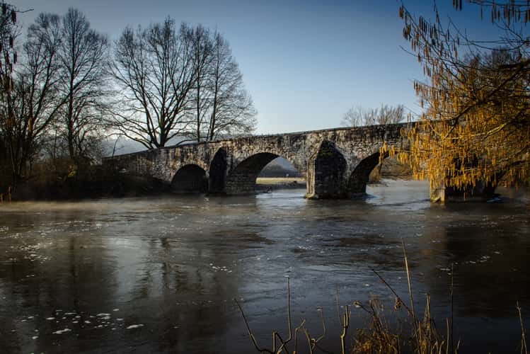 Ancient stone bridge over the Altmuehl River at Pfuenz