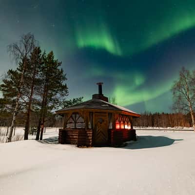 Small hut with auroras, Finland