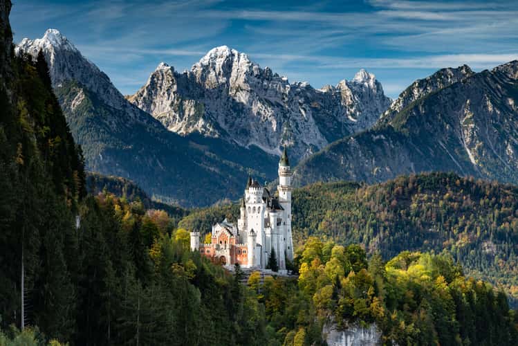 Neuschwanstein Castle with Mountain Range Backdrop