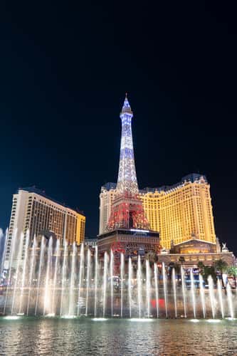 The Paris and Bellagio fountains show at night, Las Vegas