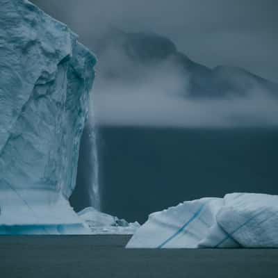 Icebergs and mountains near Rolige Bræ, Rødefjord, Greenland
