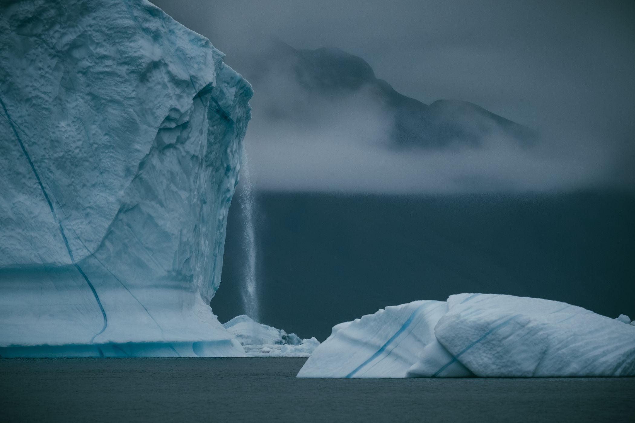Icebergs and mountains near Rolige Bræ, Rødefjord, Greenland