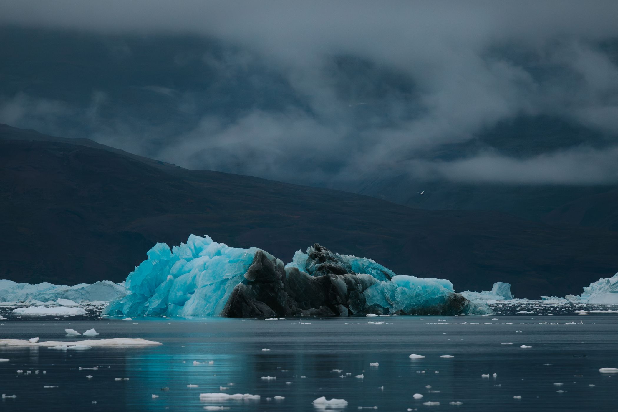 Icebergs and mountains near Rolige Bræ, Rødefjord, Greenland