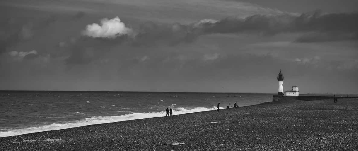 Lighthouse and pebble beach Le Treport