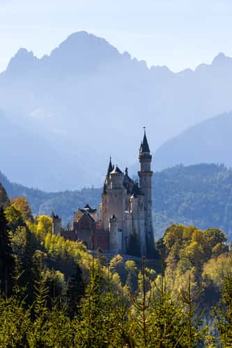 Neuschwanstein Castle with Mountain Range Backdrop