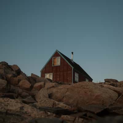 Red lonely house in Ittoqqortoormiit, Scoresbysund, Greenland