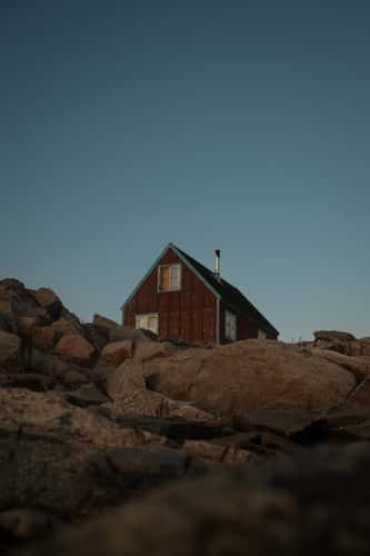 Red lonely house in Ittoqqortoormiit, Scoresbysund