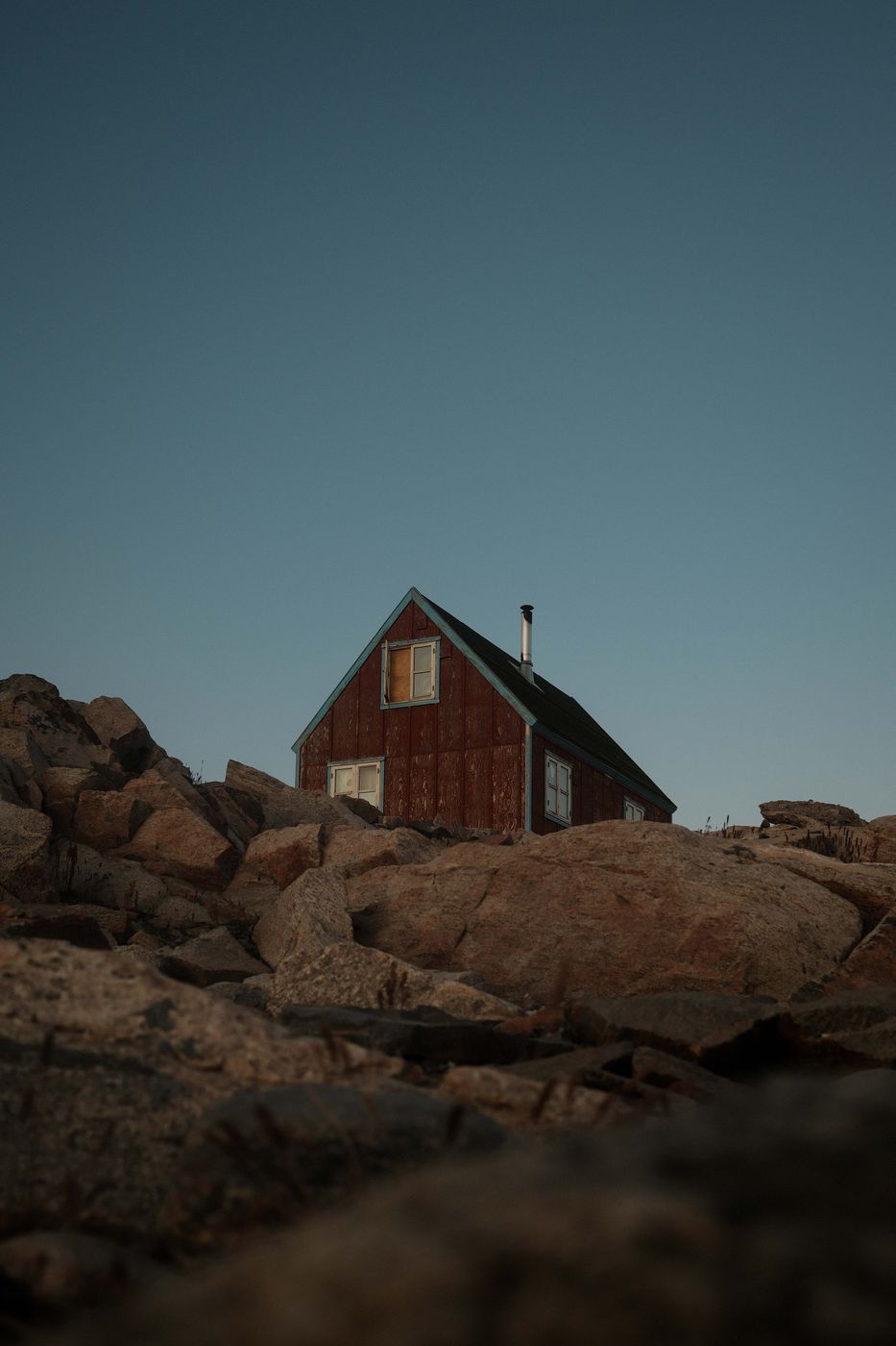 Red lonely house in Ittoqqortoormiit, Scoresbysund, Greenland