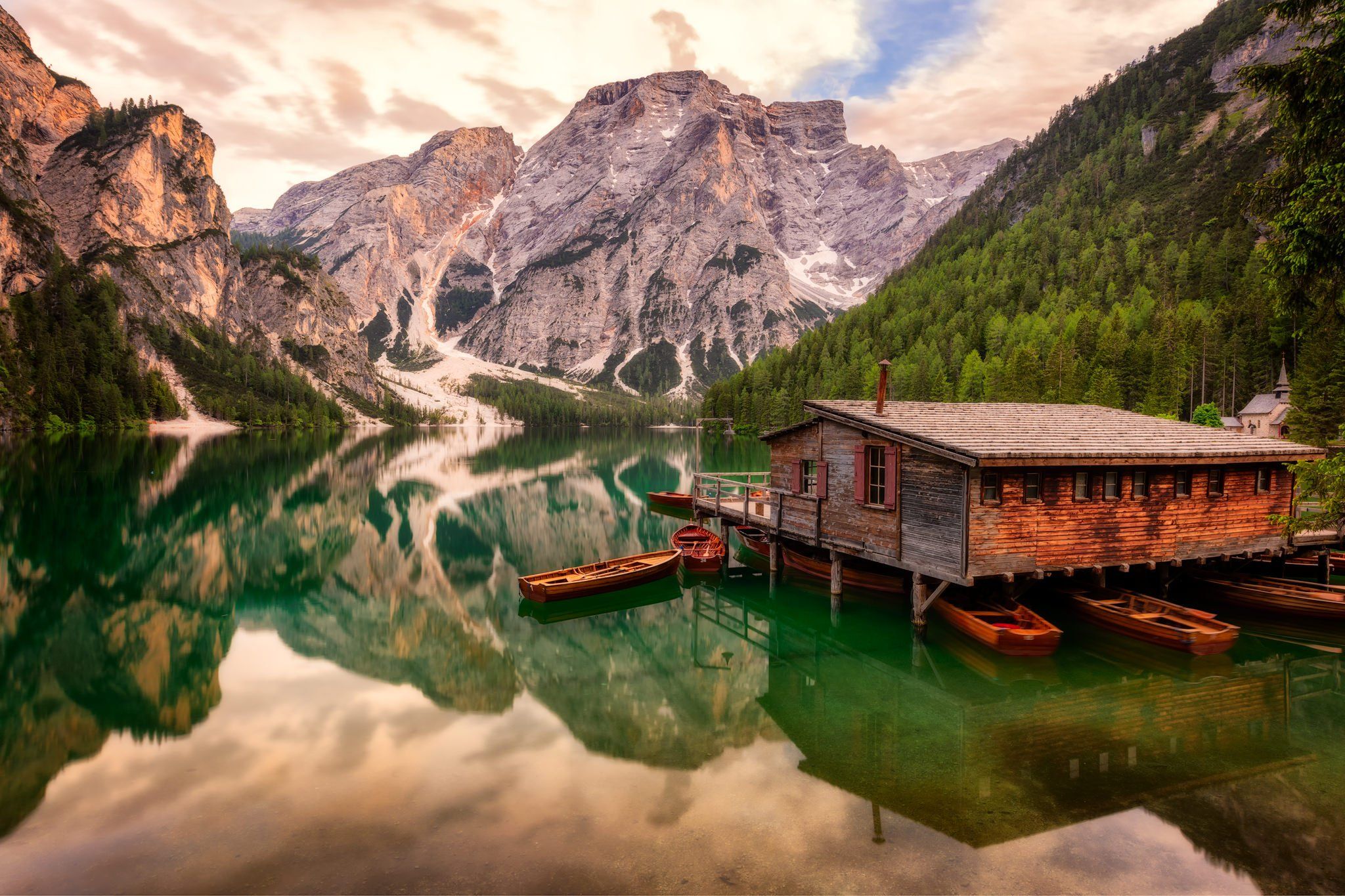 Wooden house on Lago Braies in Dolomites, Italy