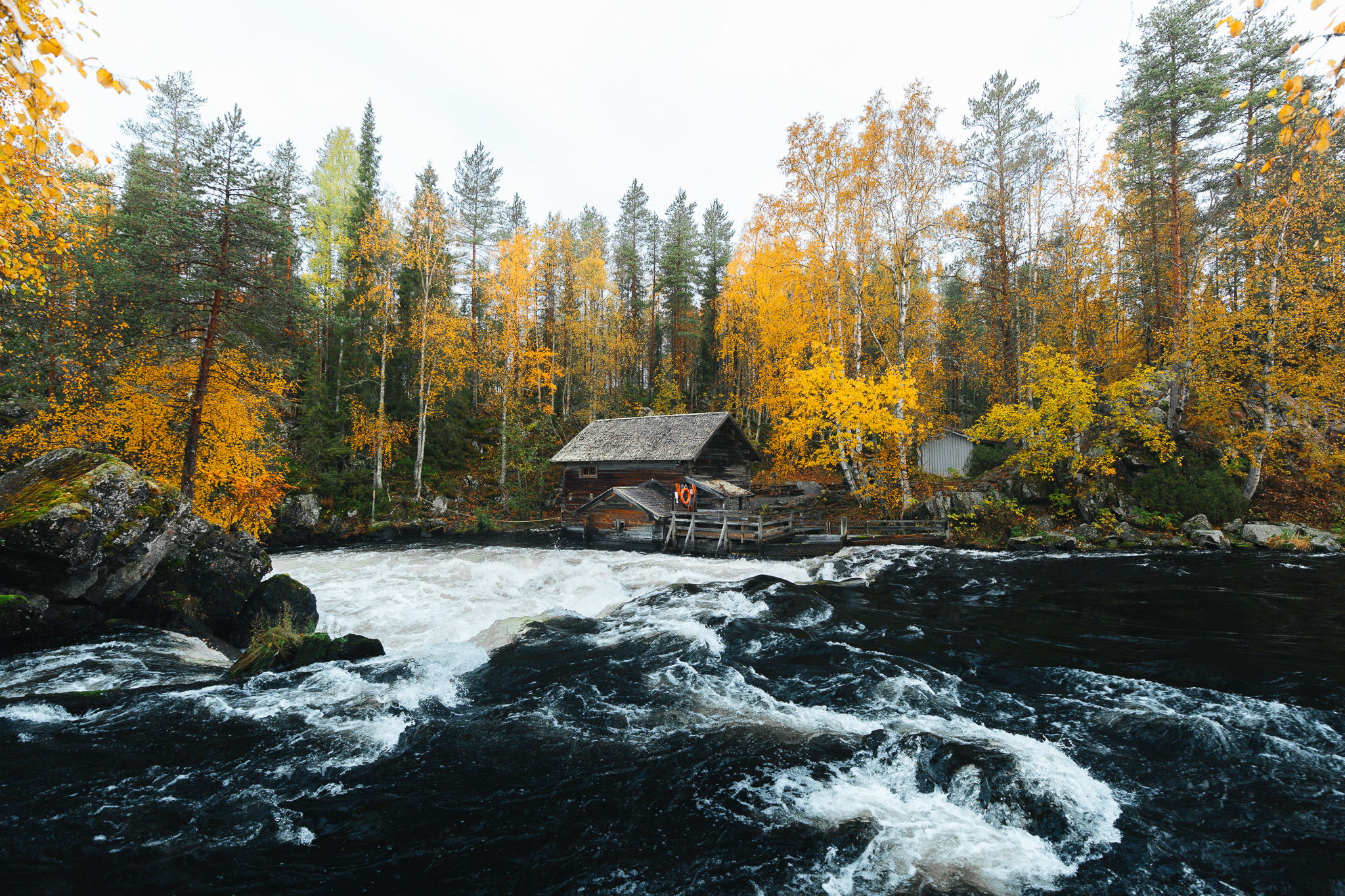 Myllykoski Mill across the rapids., Finland