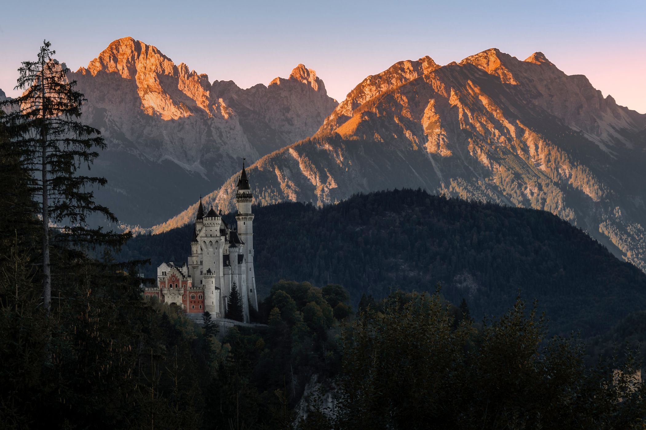 Neuschwanstein Castle with Mountain Range Backdrop, Germany